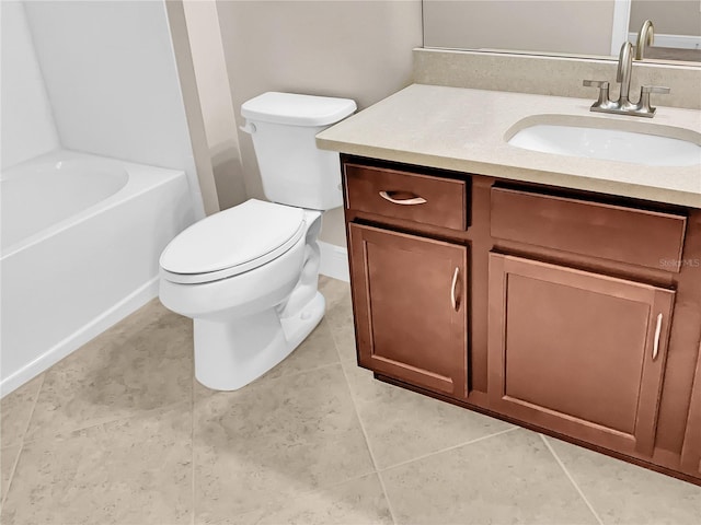 bathroom featuring vanity, toilet, and tile patterned flooring