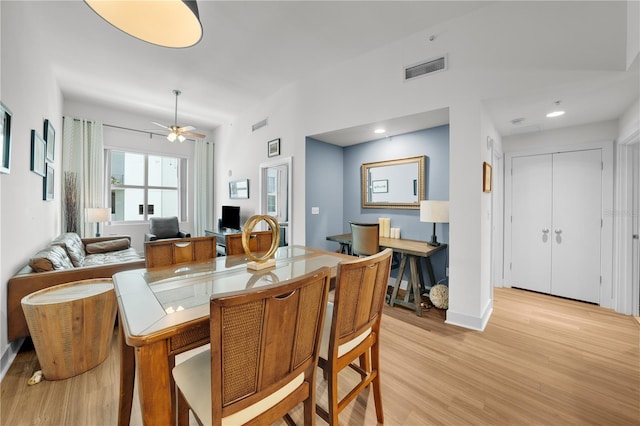 dining space featuring light hardwood / wood-style floors and ceiling fan