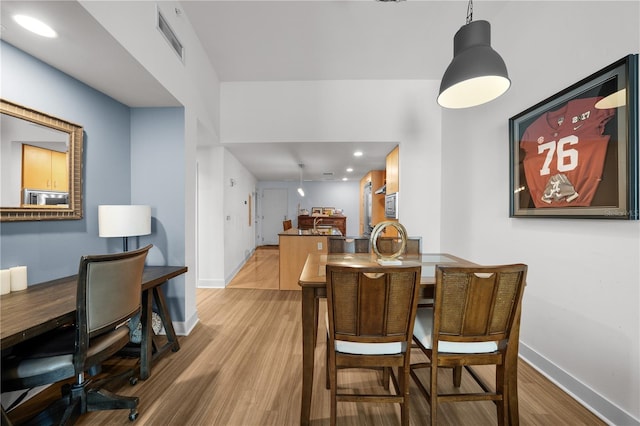 dining space featuring light hardwood / wood-style flooring