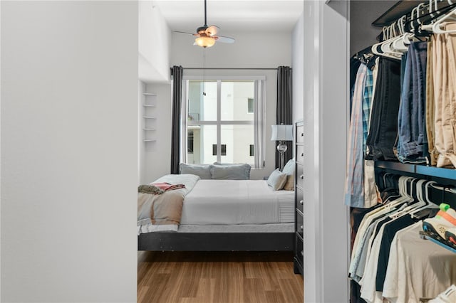 bedroom with hardwood / wood-style flooring and ceiling fan