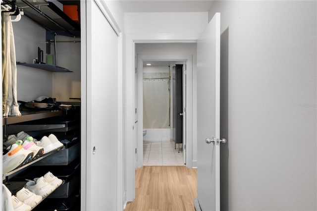 corridor featuring light hardwood / wood-style flooring