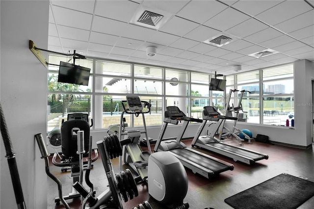 workout area featuring a drop ceiling