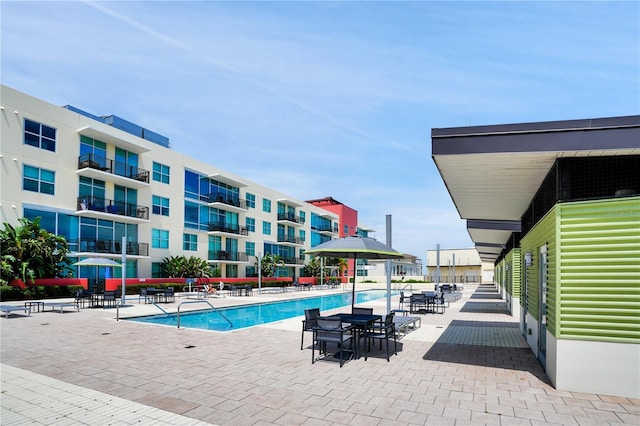 community pool featuring a patio area