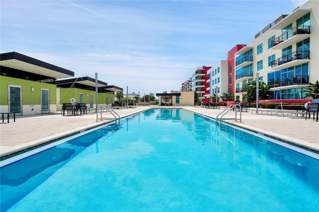 view of swimming pool with a patio