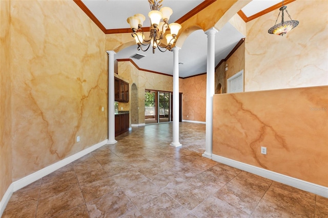 tiled spare room featuring a notable chandelier, ornate columns, and crown molding