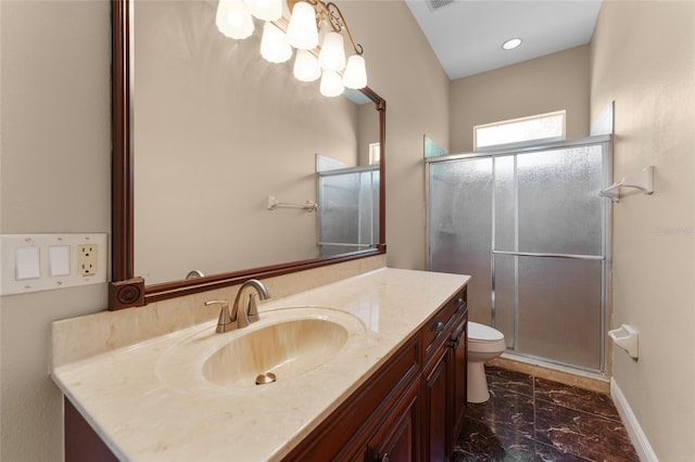 bathroom with vanity, toilet, tile patterned flooring, and an enclosed shower