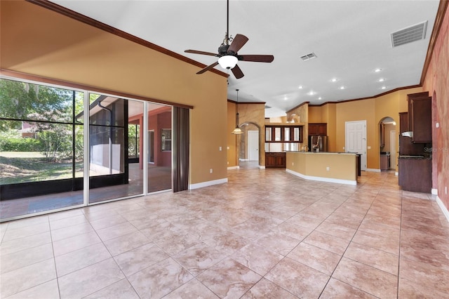 unfurnished living room featuring a ceiling fan, arched walkways, visible vents, and ornamental molding