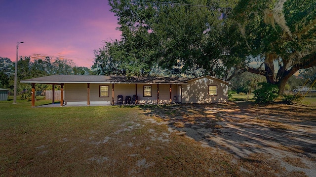 ranch-style house with a yard and a patio