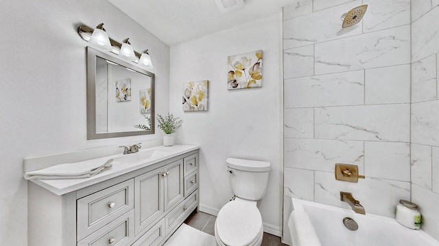 full bathroom featuring vanity, tiled shower / bath combo, and toilet