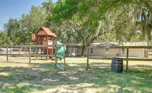 view of play area featuring a lawn