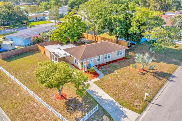 birds eye view of property with a water view