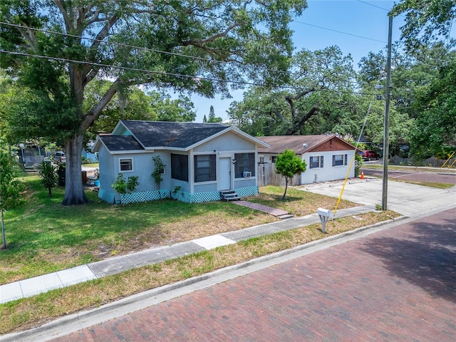 view of front facade with a garage and a front lawn