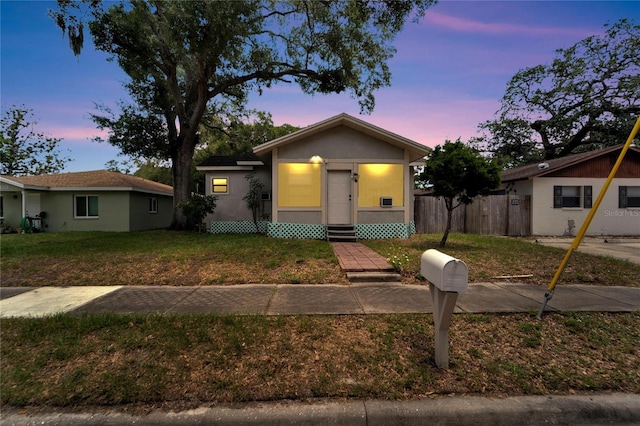 view of front of property with a yard