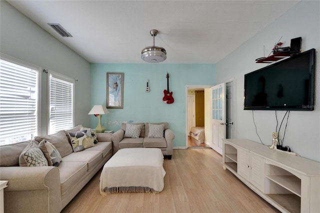 living room with light hardwood / wood-style floors