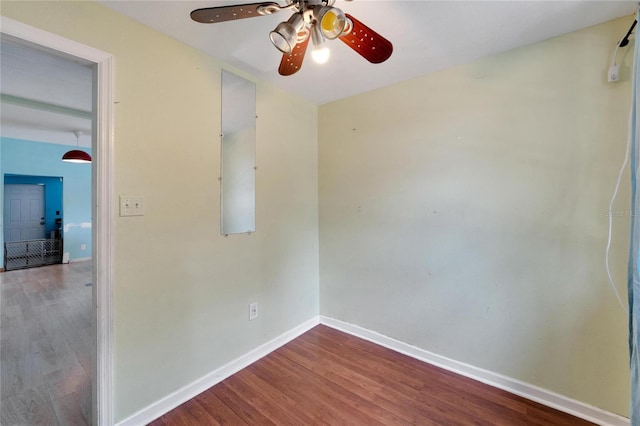 unfurnished room featuring ceiling fan and hardwood / wood-style floors