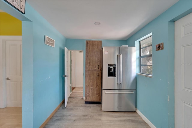 kitchen featuring light hardwood / wood-style floors and high end fridge