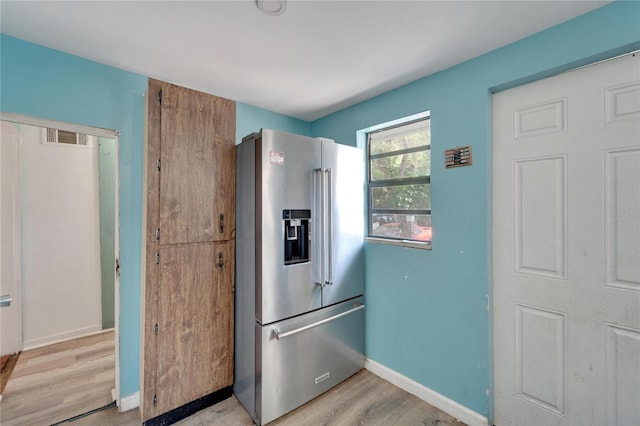 kitchen featuring light hardwood / wood-style floors and high end refrigerator