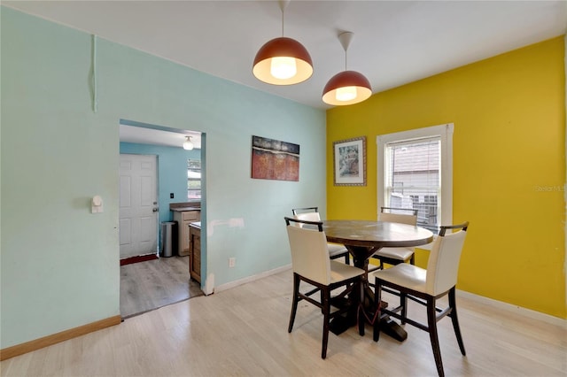 dining area with hardwood / wood-style flooring