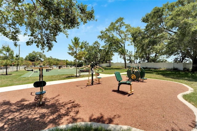 exterior space with a playground and a lawn