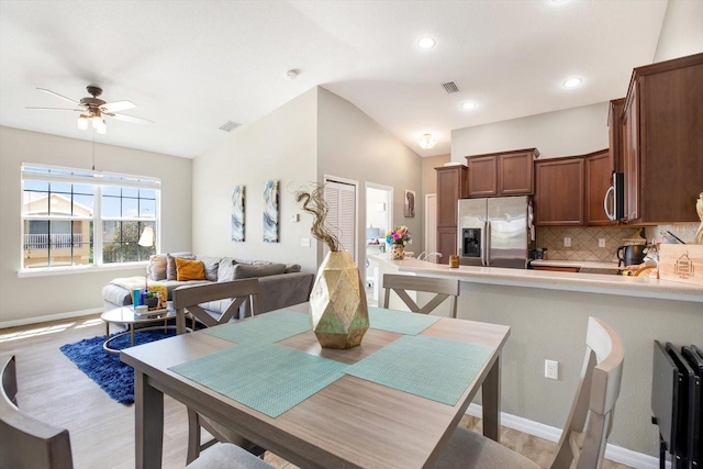 dining area featuring ceiling fan and light wood-type flooring