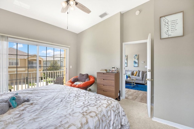 bedroom with ceiling fan, light colored carpet, vaulted ceiling, and access to outside