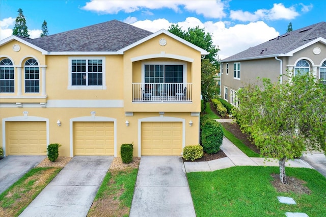 townhome / multi-family property featuring a balcony