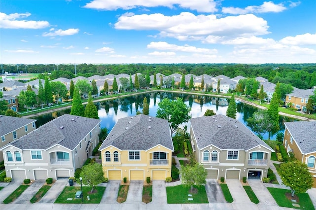 birds eye view of property with a water view