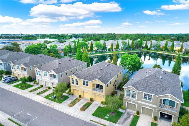 birds eye view of property featuring a water view