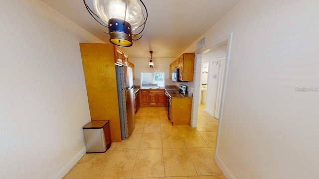 corridor featuring light tile floors