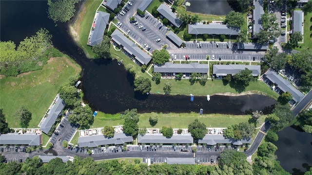 birds eye view of property with a water view