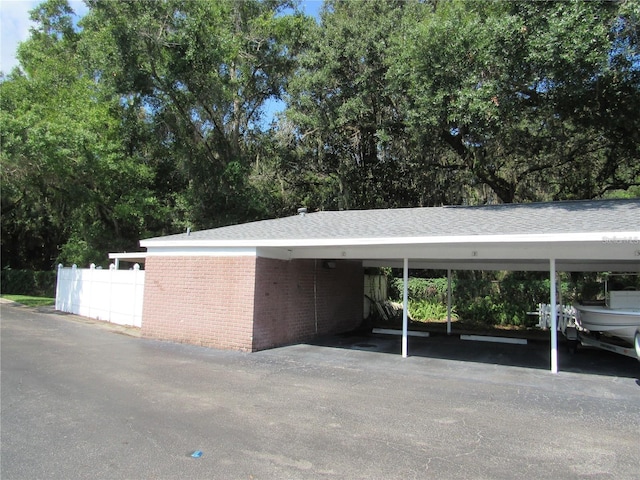 view of vehicle parking featuring a carport