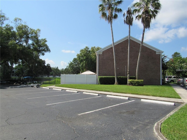 view of car parking with a yard