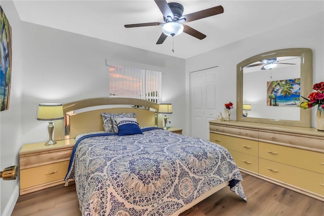 bedroom featuring wood-type flooring, a closet, and ceiling fan