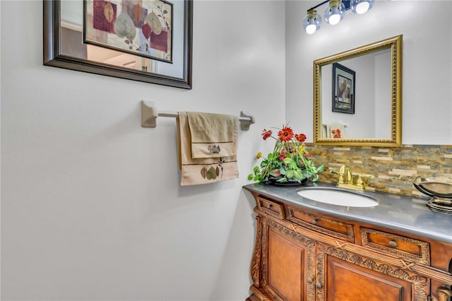 bathroom featuring tasteful backsplash and vanity