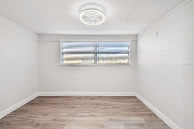 unfurnished room with light hardwood / wood-style floors