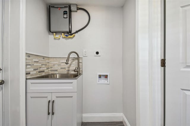 laundry room featuring cabinets, sink, hookup for a washing machine, water heater, and hookup for an electric dryer