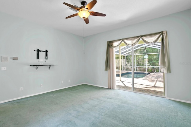 carpeted empty room with ceiling fan