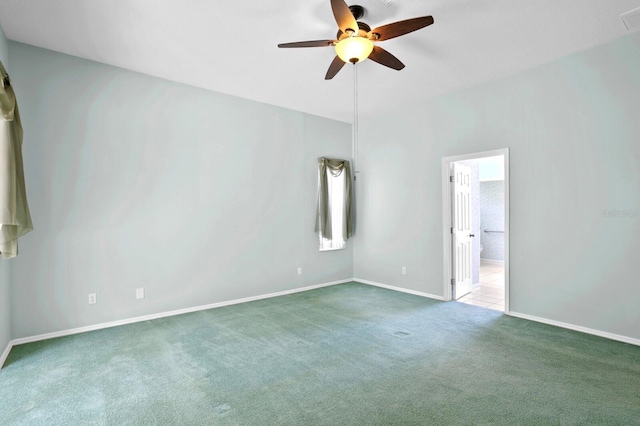 spare room with carpet floors and ceiling fan