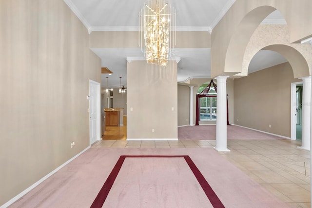 interior space with a notable chandelier, ornamental molding, decorative columns, and light tile floors