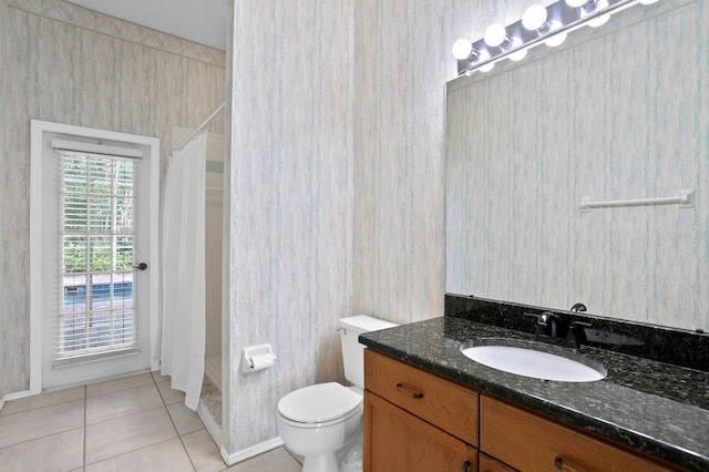 bathroom featuring vanity, curtained shower, tile patterned floors, and toilet