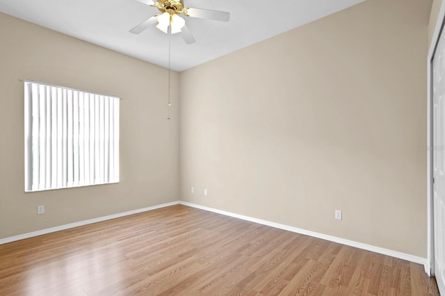 empty room with light wood-type flooring and ceiling fan