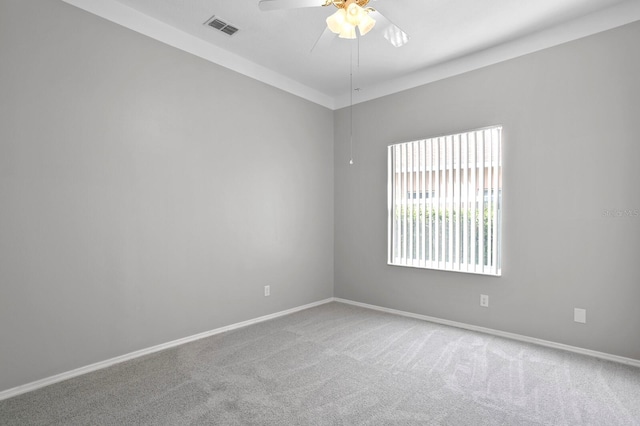 spare room with ceiling fan and carpet floors