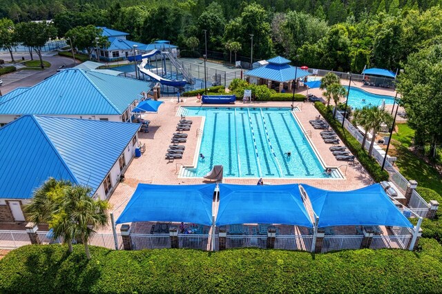 view of swimming pool with a water slide