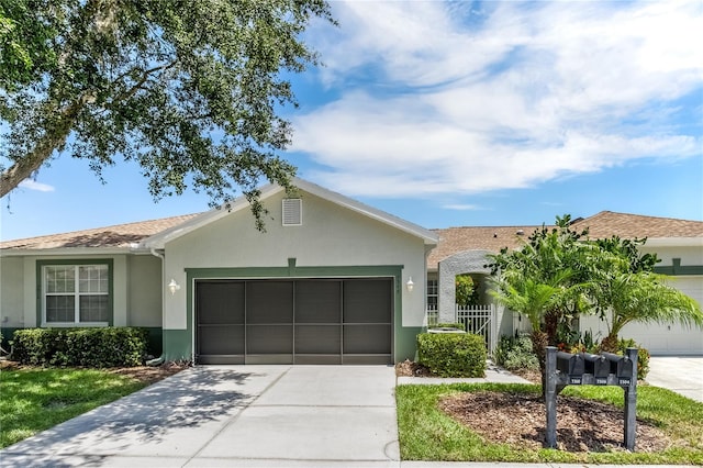 ranch-style house featuring a garage