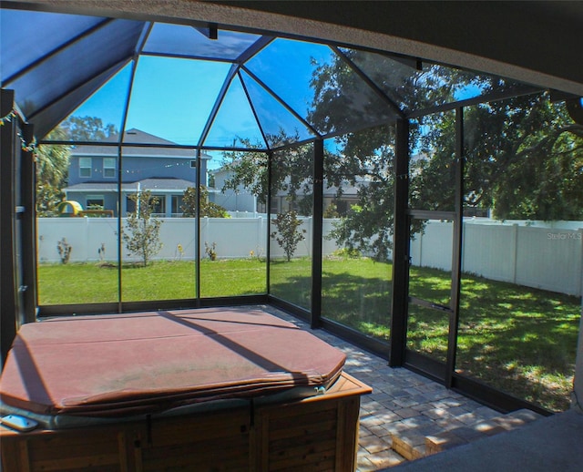 unfurnished sunroom with lofted ceiling