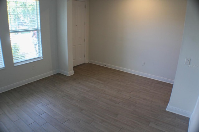 spare room with hardwood / wood-style flooring