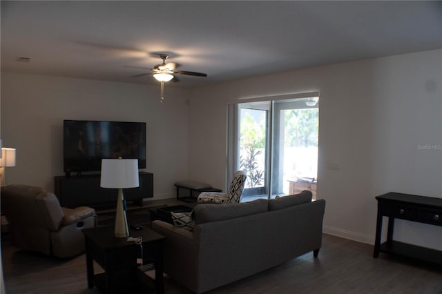 living room with hardwood / wood-style flooring and ceiling fan