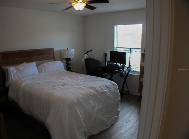 bedroom with ceiling fan and light hardwood / wood-style floors