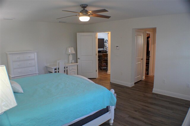 bedroom featuring ceiling fan and dark wood-type flooring