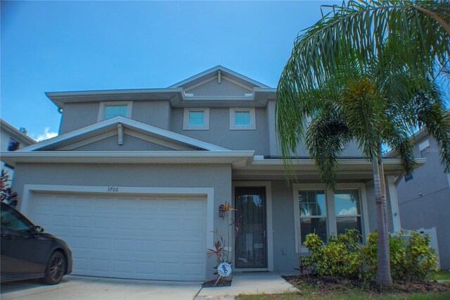 view of front of home with a garage